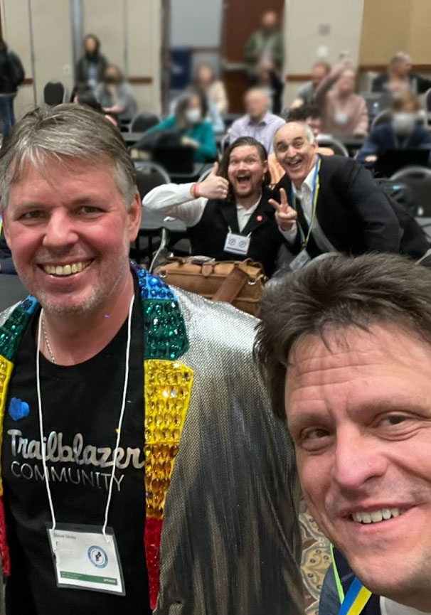 Stevemo and Charlie Issacs selfie with Garry and another event attendee giving a thumbs up in the background